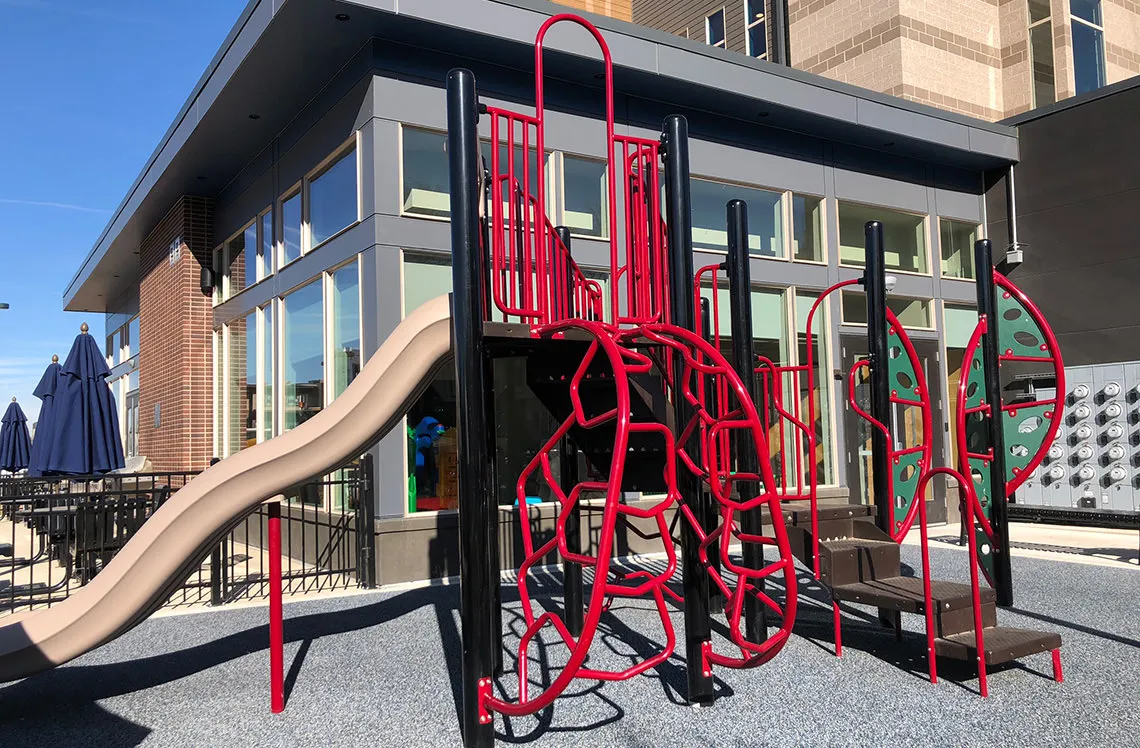 Metal climbing structure to slide at Boulevard One Residences